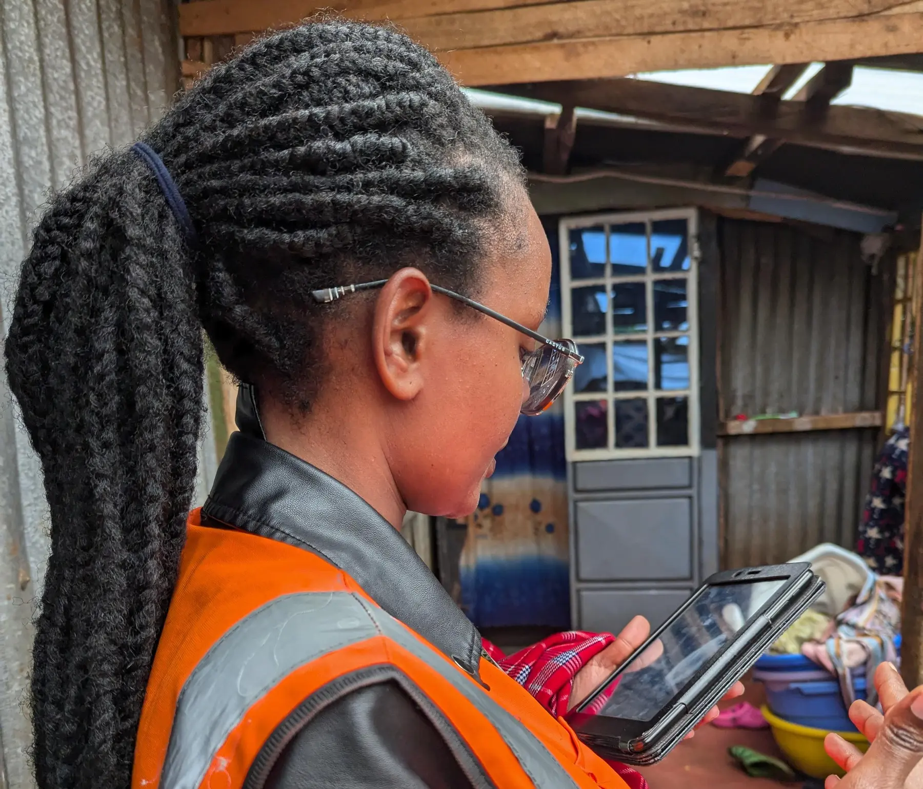 Field officer conducting verification at a residence
